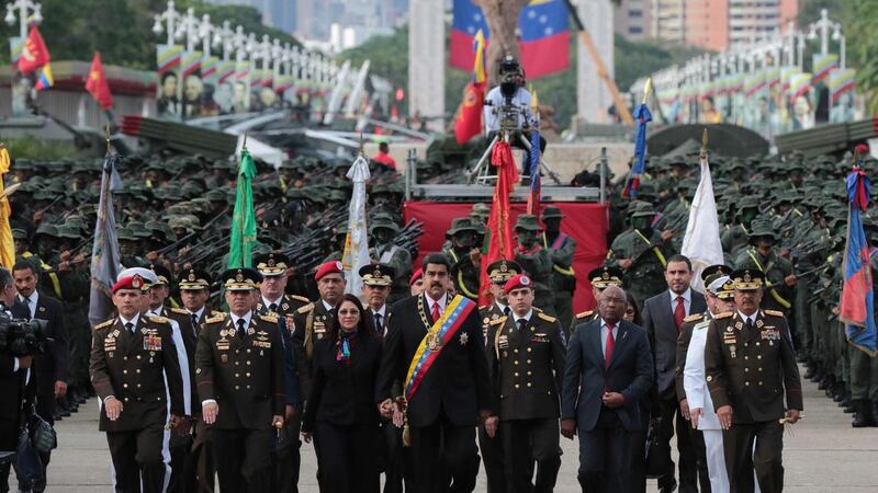 A handout picture made available by the Presidency of Venezuela president Nicolas Maduro (centre) and first lady Cilia Flores (centre-left) during a ceremony commemorating the 195th anniversary of the Battle of Carabobo in Caracas this week. The battle, fought between independence fighters and Spanish royalist forces in 1821, led to the independence of Venezuela from Spain. Photograph: EPA