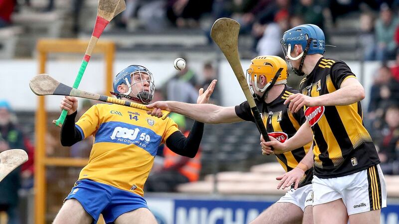 Shane O’Donnell is tackled by Billy Ryan. Photo: Bryan Keane/Inpho