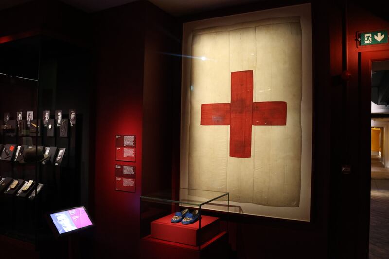 Michael Collins's slippers are in a display case beside a Red Cross flag which covered his body after he was killed at Béal na Bláth. Photograph: Ronan McGreevy