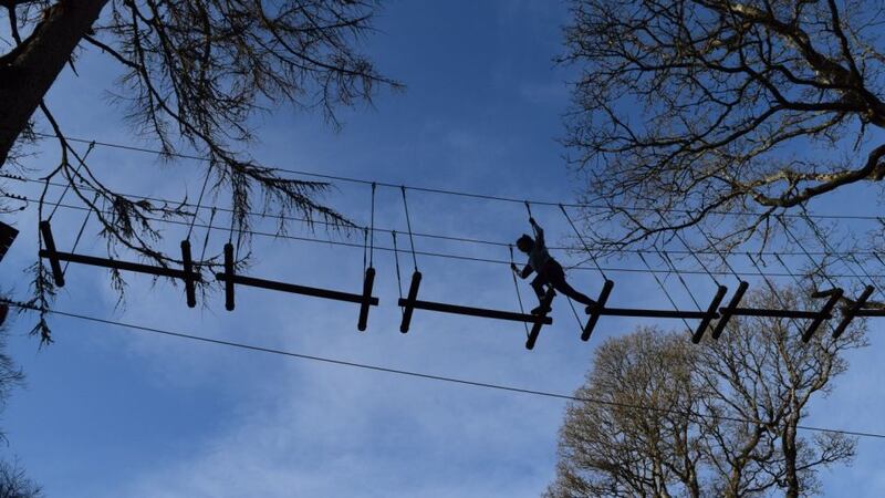 Navigating one of the highline challenges in Zipit in Lough Key