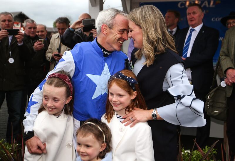Walsh embraces his wife Gillian and daughters Isabelle, Elsa and Gemma after announcing his retirement at Punchestown on Wednesday. Photograph: Tommy Dickson/Inpho