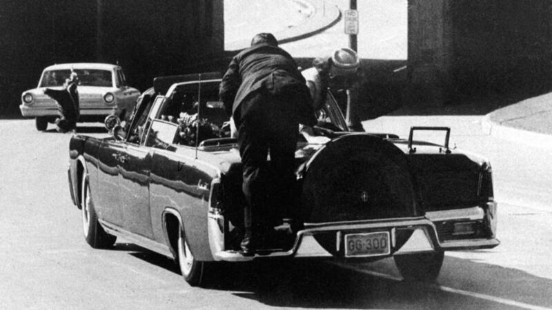 Then secret service agent Clint Hill on the back of the president’s car after the shooting. Photograph: James W “Ike” Altgens/AP