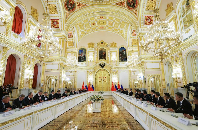 Russian president Vladimir Putin, China's president Xi Jinping and members of their delegations hold a meeting at the Kremlin in Moscow on Tuesday. Photograph: Sergei Karkuphin/Sputnik/AFP via Getty Images