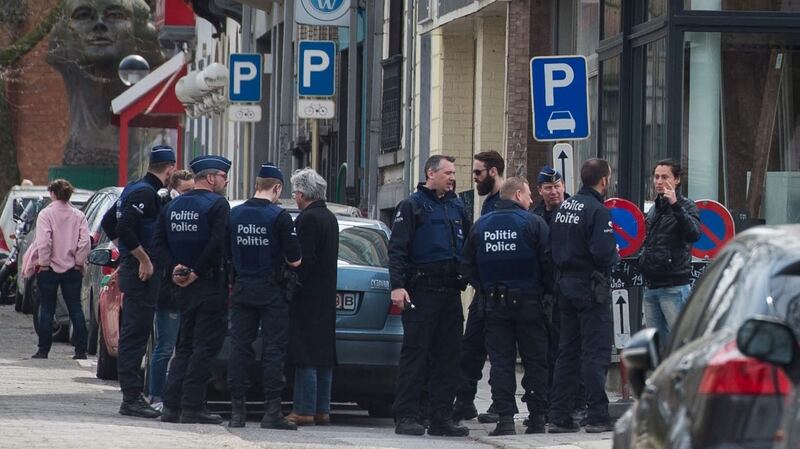 Belgian police during a search in Etterbeek, Brussels. Photograph: Stephanie Lecocq/EPA