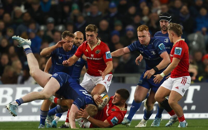 Leinster's Jamie Osborne tackles Alex Nankivell of Munster. Photograph: Tom Maher/Inpho