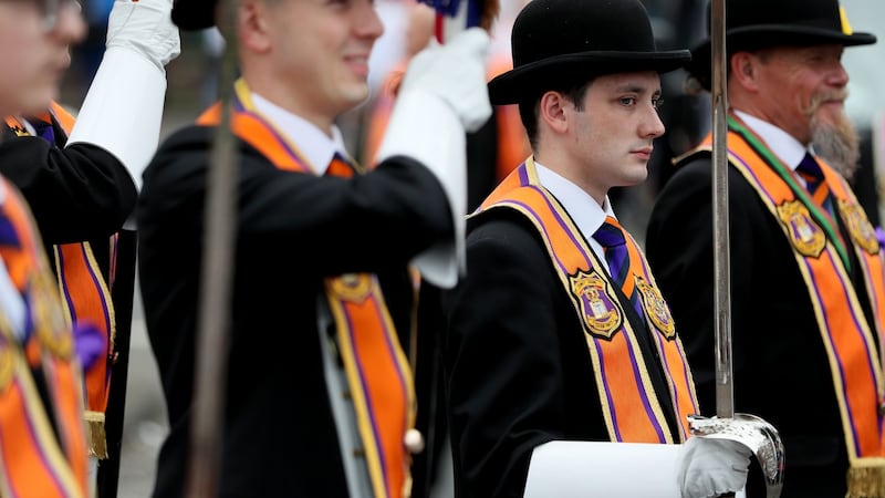 Bandsmen and Orange Order members take part in an Orange Order parade in Belfast. Photograph: Brian Lawless/PA