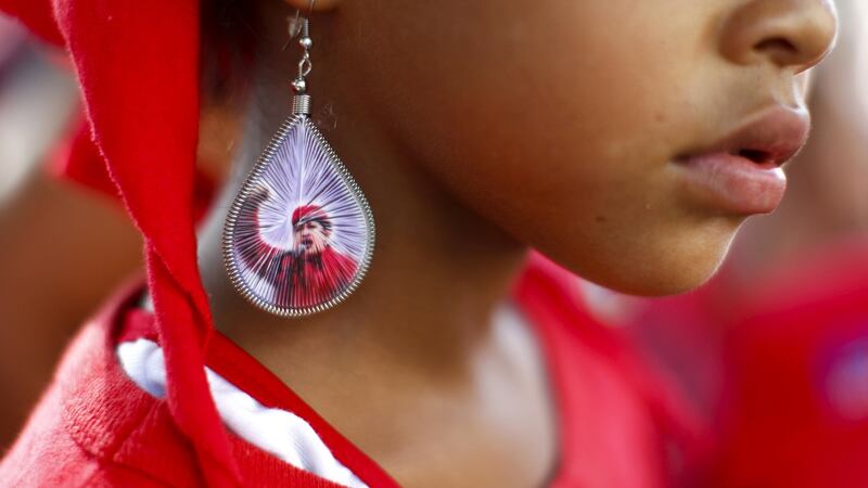 A supporter of Venezuelan president Hugo Chávez at  a campaign rally in  September  2012. Photograph: Jorge Silva/Reuters