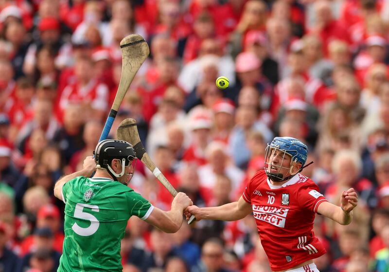 Limerick’s Diarmaid Byrnes and Diarmuid Healy of Cork during the Munster hurling final. Photograph: James Crombie/Inpho