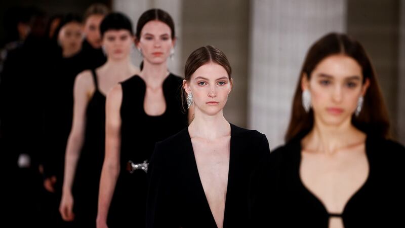 Black dresses from  Victoria Beckham’s autumn/winter collection. Photograph: Henry Nicholls/Reuters