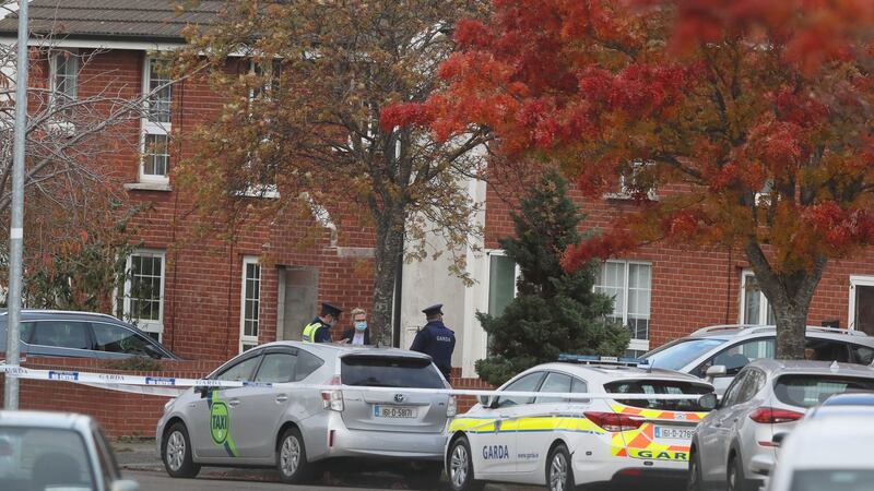 Gardaí at the  house in the Llewellyn estate, Ballinteer, south Dublin, where the bodies of a  mother and  two young children were found on Wednesday. Photograph: Brian Lawless/PA Wire