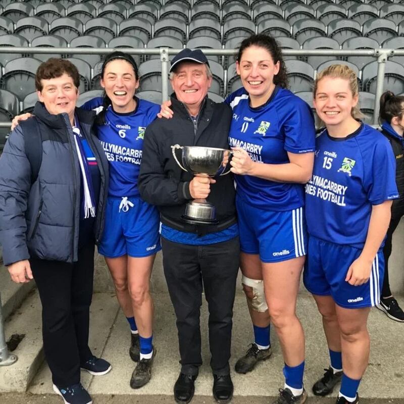 Michael Ryan and his family celebrate after Ballymacarbry's Munster title win. 