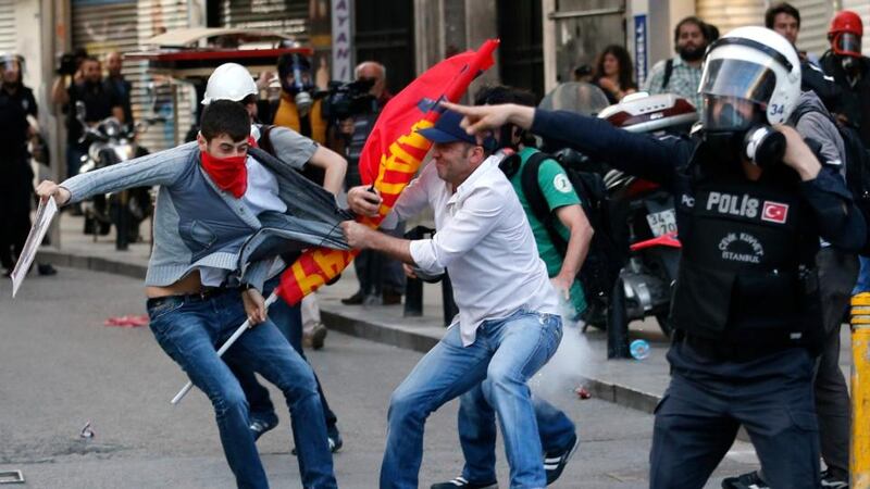 Plain clothes police detain a protester during a demonstration in Istanbul to blame the ruling AK Party (AKP) government for the mining disaster in Soma, western Turkey. Photograph: Murad Sezer/Reuters.