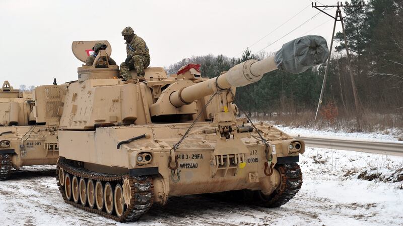 US military equipment is unloaded in Camp Drawsko Pomorskie, Poland, as part of the Nato deployment. Photograph: Marcin Bielecki/EPA
