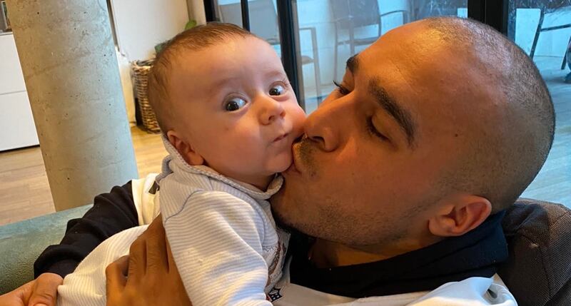 Simon Zebo with his four-month old son Noah at his house in Paris. Photograph courtesy of Simon Zebo.