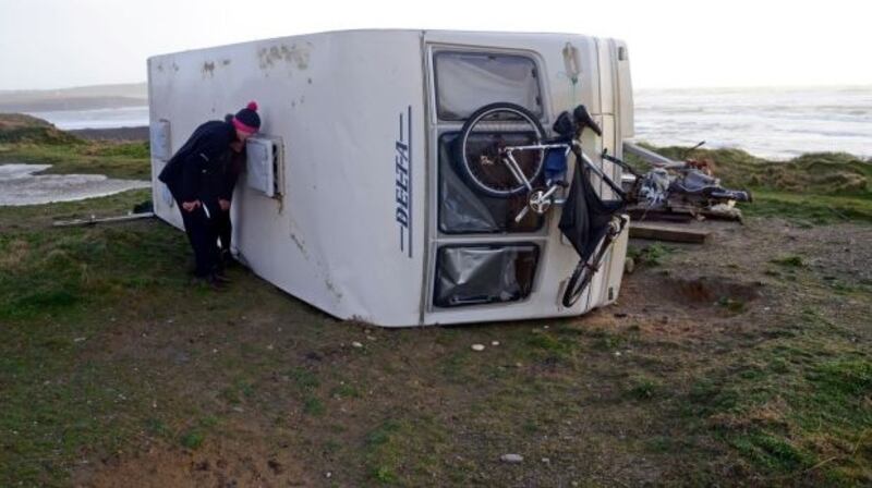 An overturned caravan near the beach at Garretstown, Co Cork. Photograph: Denis Boyle