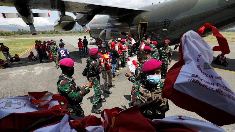 Soldiers unload food aid from a Singapore Armed Forces (SAF) supply plane at Mutiara Sis Al-Jufri Airport in Palu, Indonesia. Photograph: Darren Whiteside/Reuters