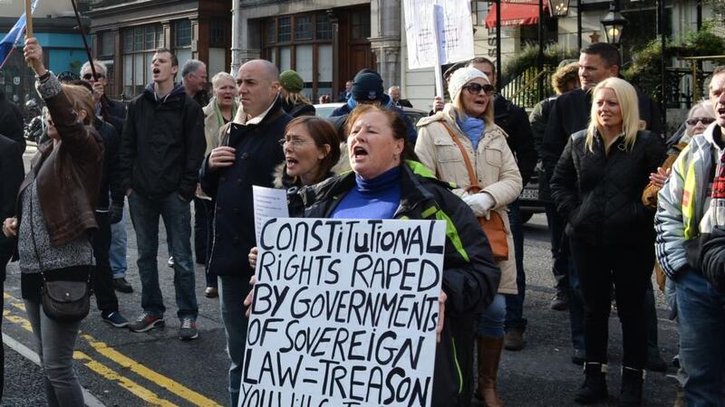 Anti-water charges protesters demonstrate outside the Mansion House as An Taoiseach Enda Kenny and Minister for Heritage Heather Humphreys attend a Royal Irish Academy event. Photograph; Dara MacDónaill/The Irish Times