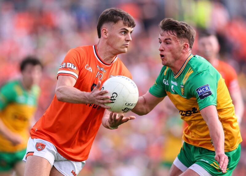 Armagh's Darragh McMullen takes on Peadar Mogan of Donegal during last Saturday's Ulster final in Clones. Photograph: Ben Brady/Inpho