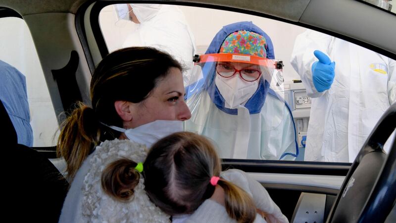 A health worker performs a swab test of a motorist in Pozzuoli near Naples, Italy on Thursday. Photograph: Ciro Fusco/EPA