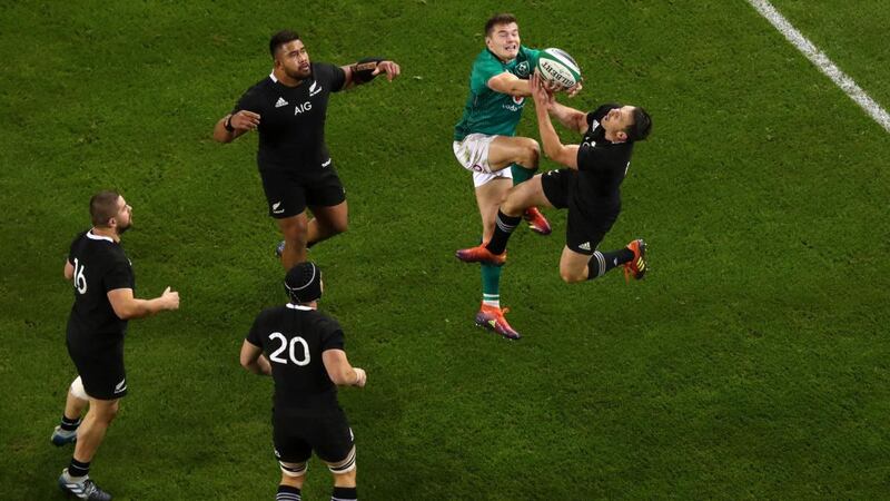 Ireland’s Jacob Stockdale goes up for a high ball with New Zealand’s  Ben Smith  during the November international in 2018 at the Aviva stadium. Photograph: Tommy Dickson/Inpho
