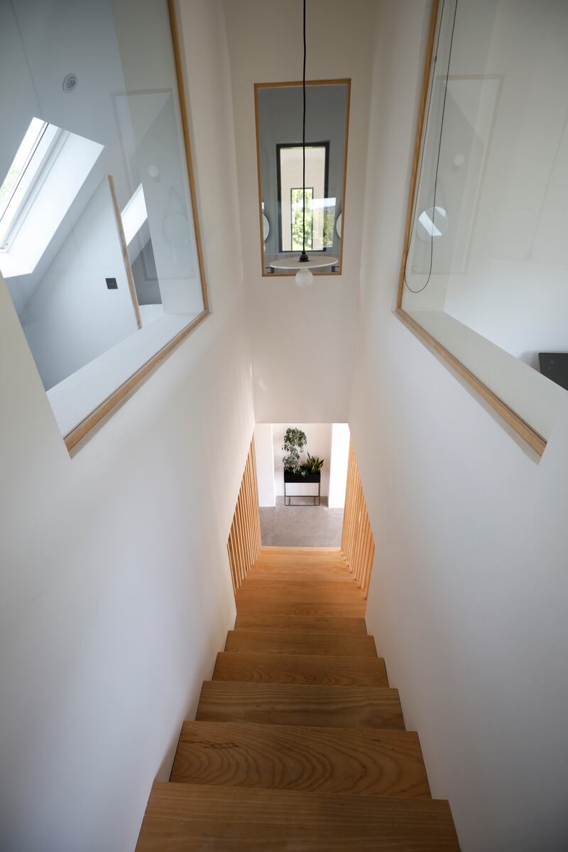 The internal windows on the stairwell brings natural light in.