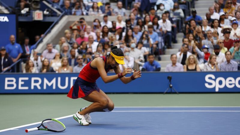 Raducanu falls to the ground after the winning point. Photo: John G. Mabanglo/EPA