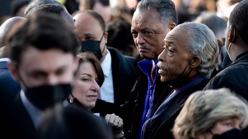 Senator Amy Klobuchar, Reverend Jesse Jackson  and civil right’s leader Rev. Al Sharpton speak following the speech by President Biden about the constitutional right to vote. Photograph: Jim Watson/AFP via Getty Images