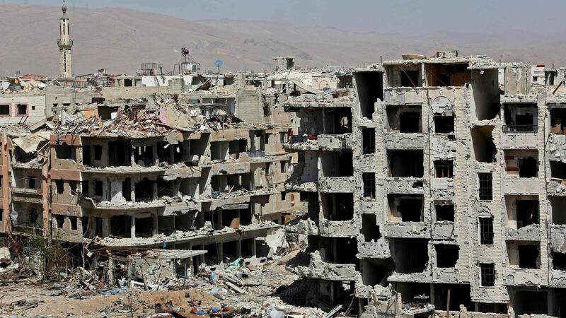 Destroyed buildings in Harasta nearly a week after the regime forces retook the town from the rebels, in eastern Ghouta on the outskirts of Damascus. Photograph:  Strstr/AFP/Getty
