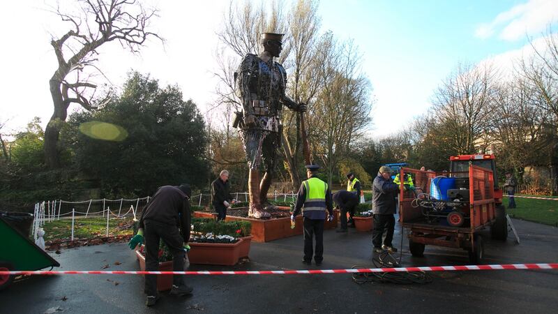 Workmen clean the Hautings Soldier which in St Stephen’s Green, Dublin. Photograph: Collins