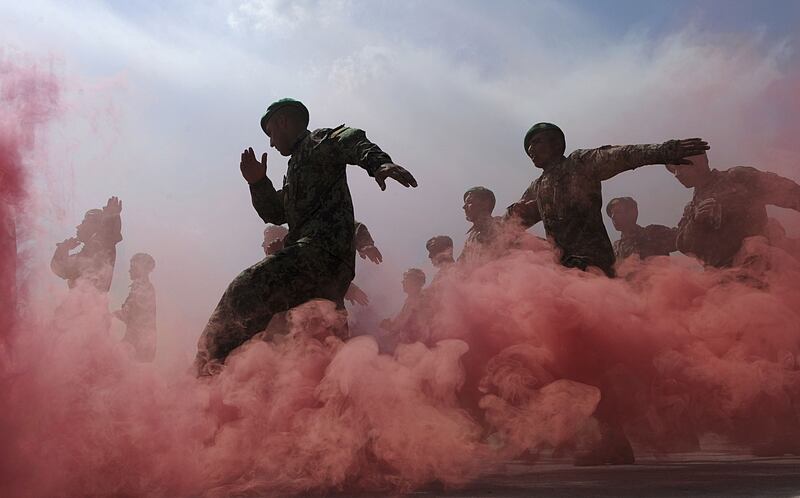 March 31st, 2011: Afghan National Army (ANA) officers march during a graduation ceremony at the Ghazi Military Training Centre in Kabul. Photograph: Shah Marai/AFP