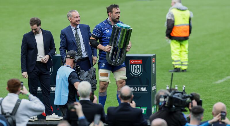 Leinster's Jack Conan is presented with the URC trophy. Photograph: Laszlo Geczo/Inpho