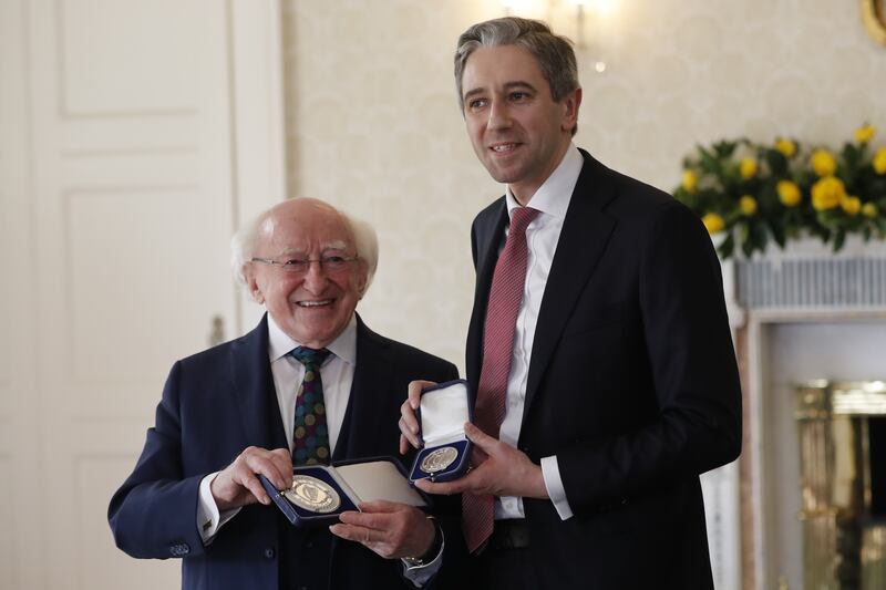 Harris and Higgins with the seal of office for the Taoiseach. Photograph: Damien Storan/PA Wire 