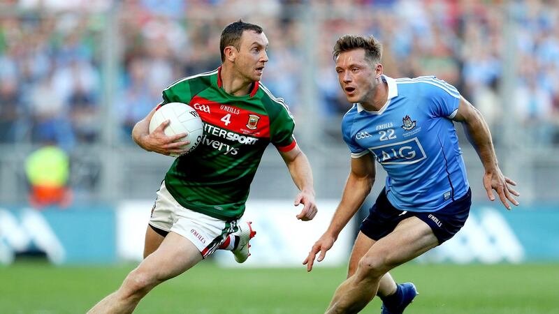 Mayo’s Keith Higgins gets away from Paul Flynn of Dublin during the All-Ireland final. Photograph: Tommy Dickson/Inpho