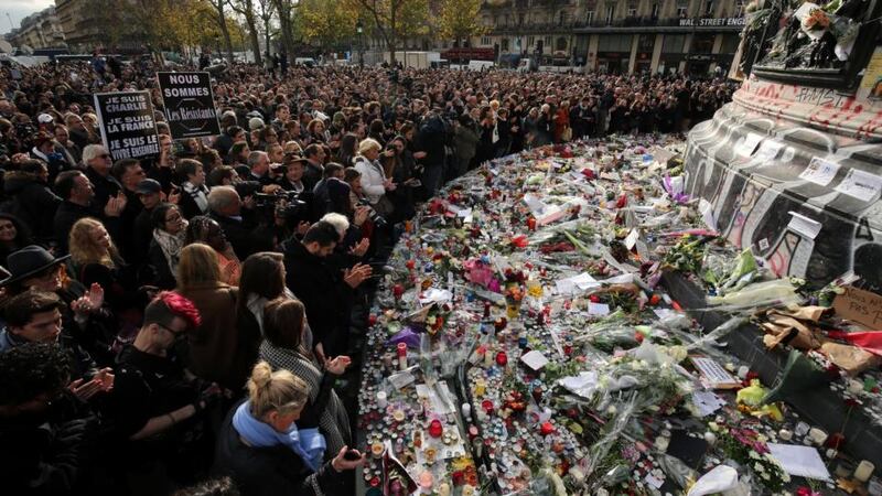 People observe a minute’s silence at the Place de la Republique in memory of the victims of the Paris terror attacks  on November 13th. Photograph: Christopher Furlong/Getty Images