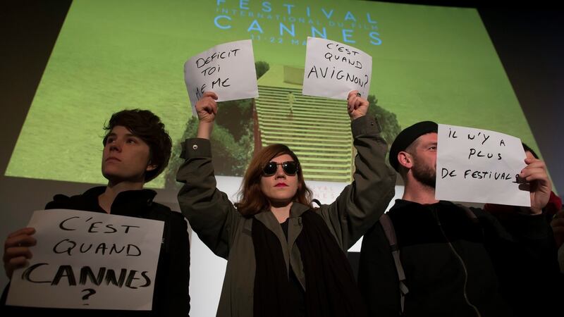Entertainment industry workers stage a protest against labour reforms before the official presentation of the film selection in competition at the upcoming 69th Cannes Film Festival, during a press conference in Paris, France, April 14th, 2016. Signs , from left, read: “When is Cannes?”, “Deficit Yourself”, “When is Avignon [festival]?” and “There is no more festival”. Photograph: Ian Langsdon/EPA