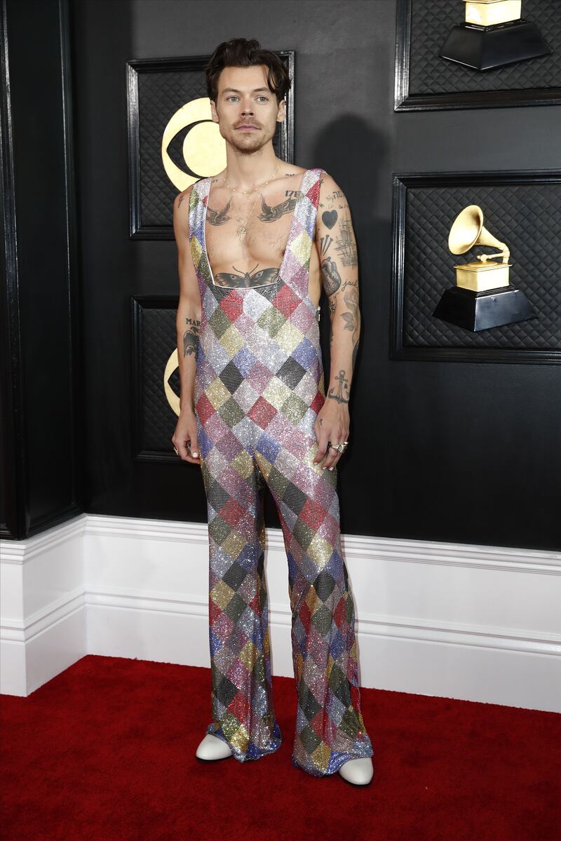 Harry Styles: Showing off the ink. Photograph: Caroline Brehman/EPA