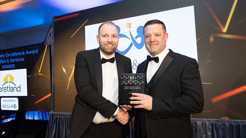 Padraic Geraghty, senior account executive at Skillko, presents the health & safety excellence award – utilities & services to Darren Bourke, Bretland Group