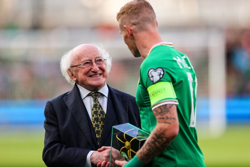 President of Ireland Michael D. Higgins presents James McClean with his 100th cap. Photograph: Ryan Byrne/Inpho