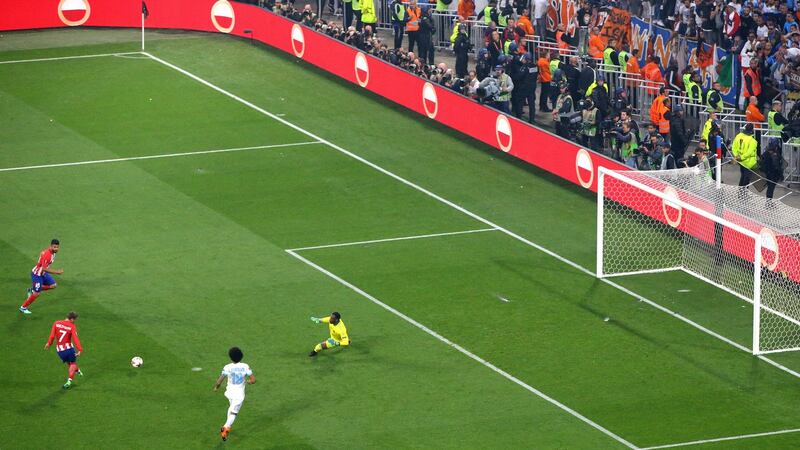 Antoine Griezmann opens the scoring for Atlético Madrid. Photograph:  Catherine Ivill/Getty Images