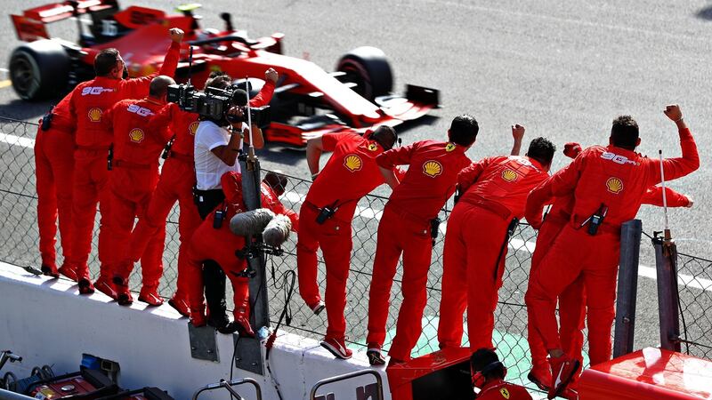 Race winner Charles Leclerc driving the (16) Scuderia Ferrari SF90 passes his team celebrating on the pitwall during the F1 Grand Prix of Italy at Autodromo di Monza. Photo: Mark Thompson/Getty Images