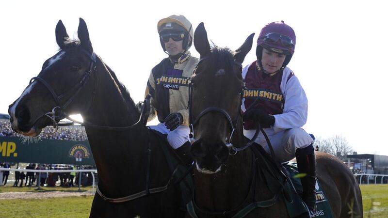 Katie Walsh  with her brother Ruby inspect the first fence 2013. Photograph: Alan Crowhurst/Getty Images