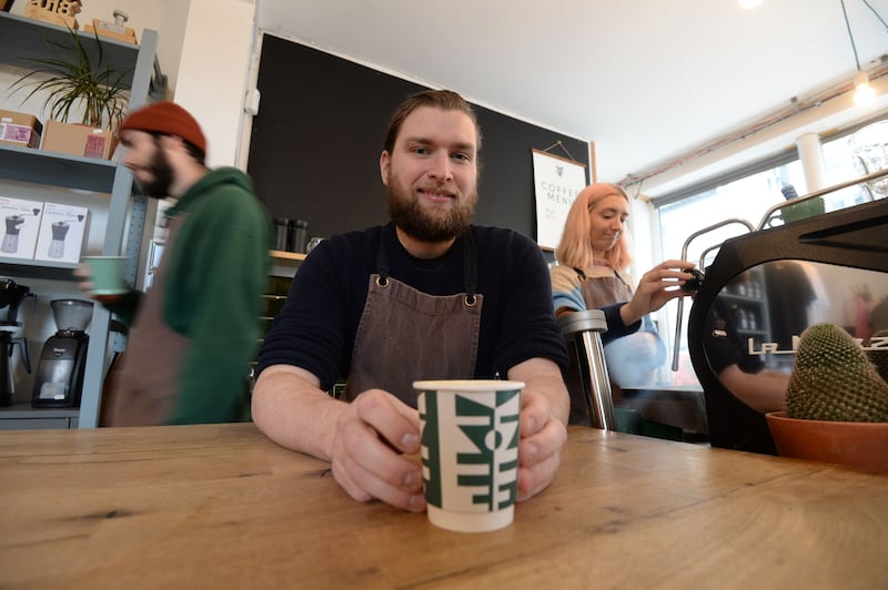 Niall Wynn, owner of Proper Order Coffee Cafe Haymarket, Smithfield, Dublin with one of his compostable coffee cups. Photograph: Alan Betson