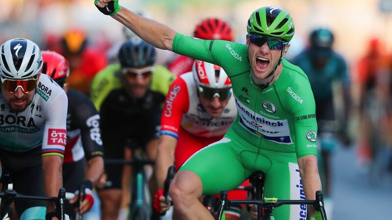 Sam Bennett celebrates crossing the line and winning the final stage of the 2020 Tour de France. Photograph: Thibault Camus/AP