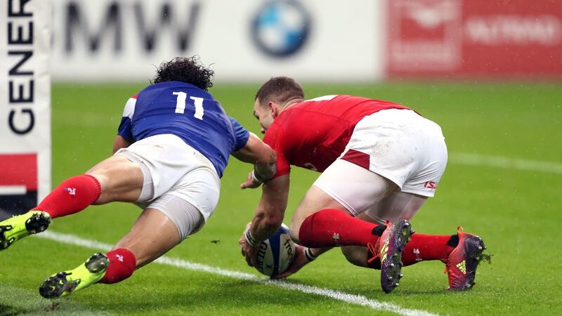 George North gets ahead of Yoann Huget to score Wales’ first try against France. Photograph: David Davies/PA