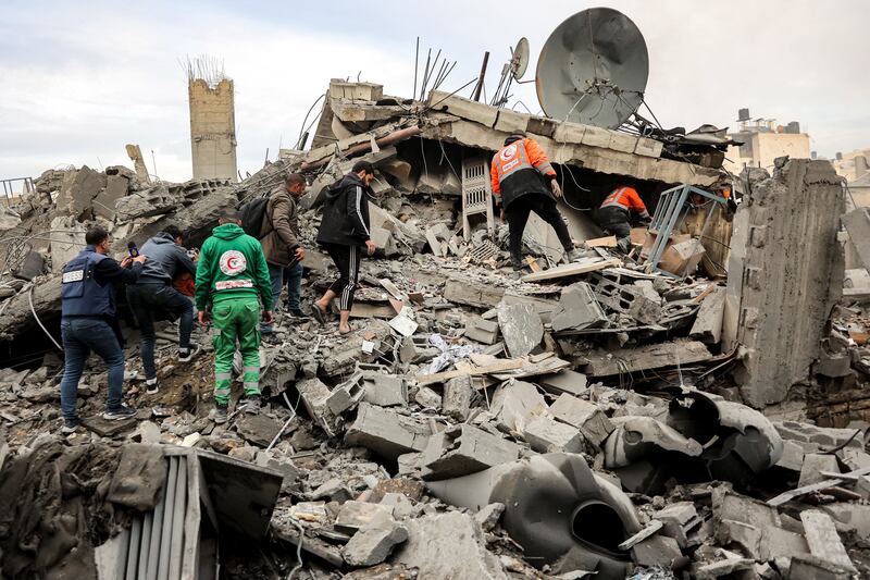 People and first responders inspect the rubble of a collapsed residential building that was hit by Israeli bombardment in the Saraya area in al-Rimal in central Gaza City on January 4th. Photograph: Omar Al-Qattaa/AFP via Getty