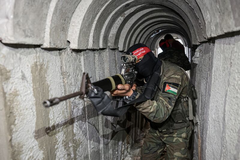 Fighters from the Democratic Front for the Liberation of Palestine in a tunnel in the southern Gaza Strip. Photograph: Said Khatib/AFP via Getty Images