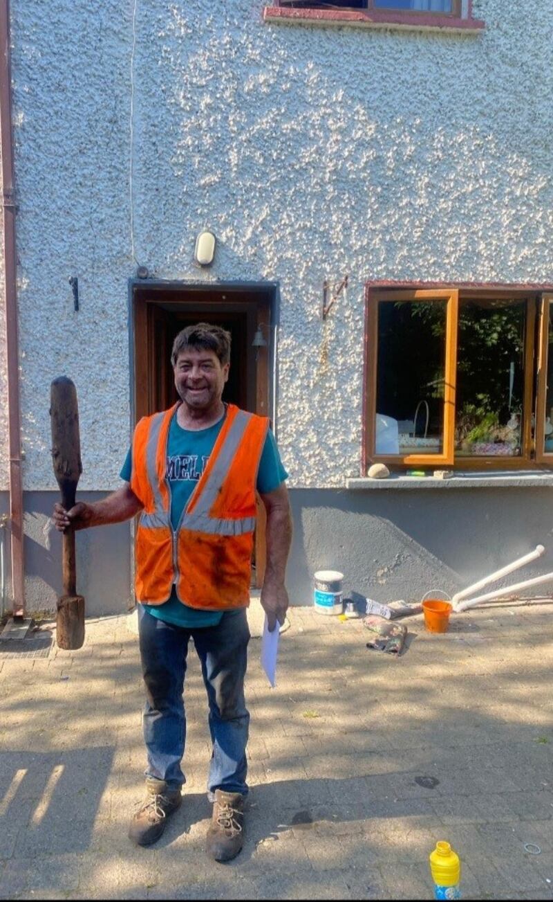 Vincent Holton with his find from a bog in Clonagh, Co Kildare, a club made of yew wood which radiocarbon dating shows to have been made around 1,400BC