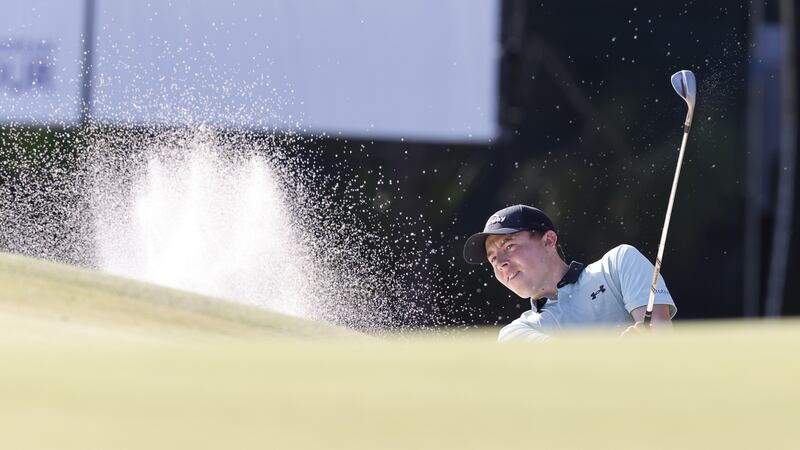 Matthew Fitzpatrick hits out of a bunker on the seventh hole. Photo: Erik S. Lesser/EPA