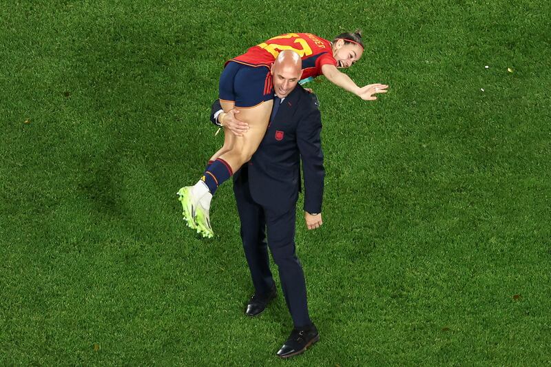 President of the Royal Spanish Football Federation Luis Rubiales carrying Spain's Athenea del Castillo Beivide on his shoulder as they celebrate winning the World Cup. Photograph: David Gray/AFP via Getty