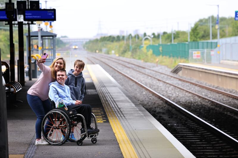 Cllr Vicki Casserly with her children Tom (9) and James (18) at Kishoge station. Photographs: Dara MacDónaill 










